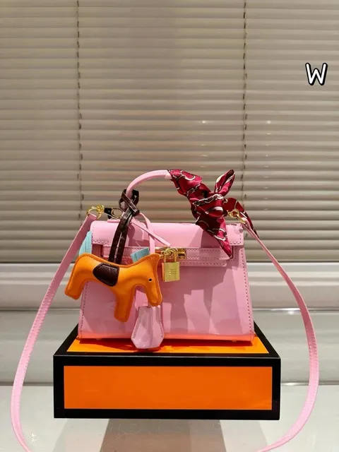 Hermès Kelly Mini Shiny Pink with Orange Rodeo Charm
