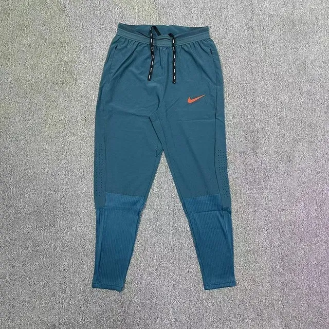 Nike Tech Fleece Joggers Teal with Orange Swoosh