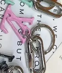 Louis Vuitton LV Logo Keychain Metallic Pink and Silver