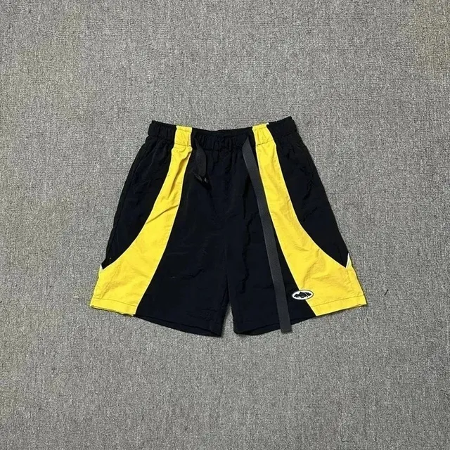 Corteiz Track Shorts Black Yellow Panel