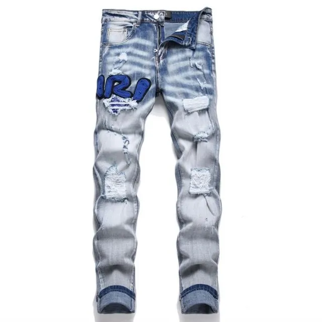 Amiri Distressed Jeans Patchwork Logo