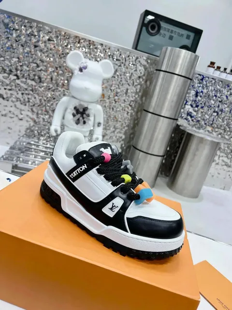Louis Vuitton sneaker black and white panelled upper with colorful lace toggles and LV monogram
