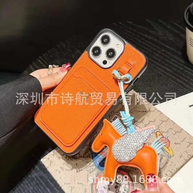 Hermès Phone Case with Charm Orange Leather with Crystal Winged Horse Charm