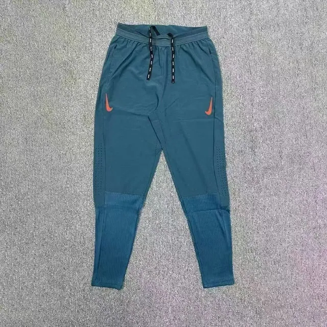 Nike Tech Fleece Joggers Teal with Orange Swoosh