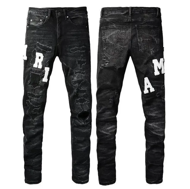 Amiri Distressed Jeans Oversized Logo Patch