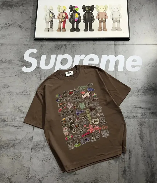 Stüssy t-shirt brown oversized tee with multi-brand graphic print