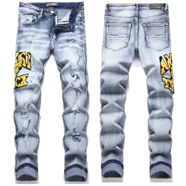 Amiri Distressed Jeans Yellow Logo Patch