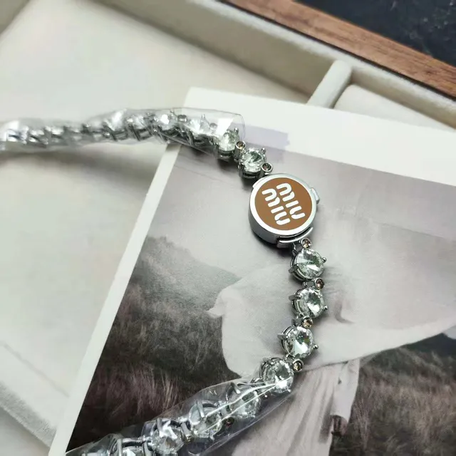 Miu Miu Crystal Chain Bracelet Brown Logo Disc