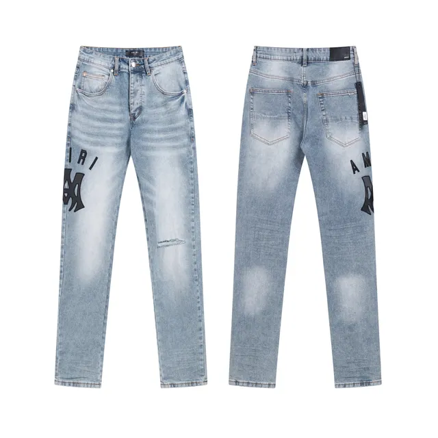 Amiri Logo Patch Jeans Light Wash with Black Appliqué