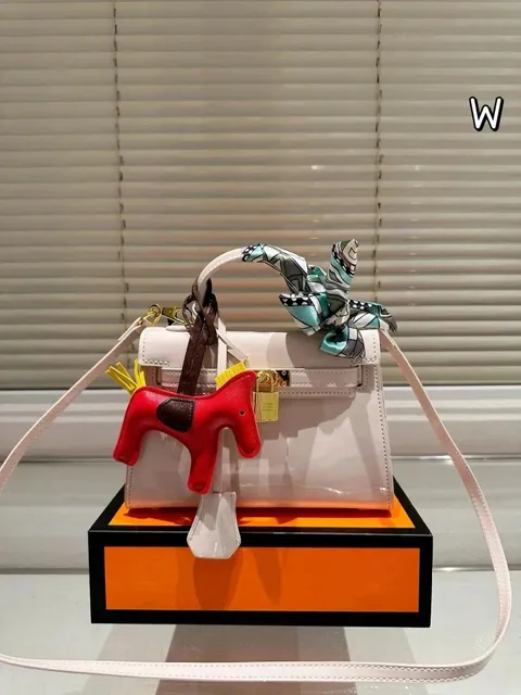 Hermès Kelly Mini Shiny White with Red Rodeo Charm