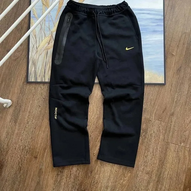 Nike Tech Fleece Joggers Black with Gold Swoosh and NOCTA Logo