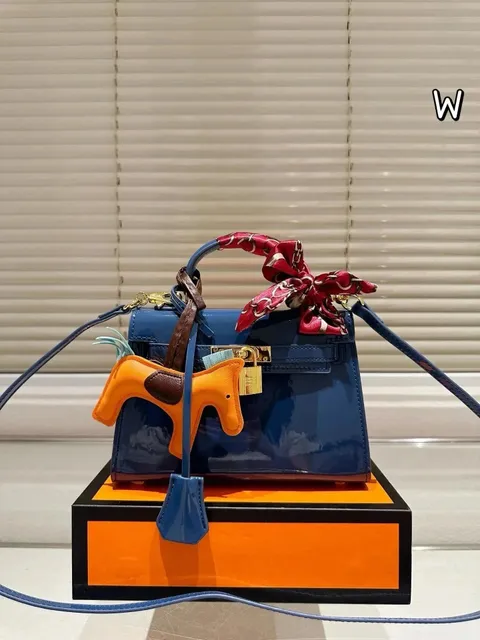 Hermès Kelly Mini II Glossy Navy with Orange Horse Charm