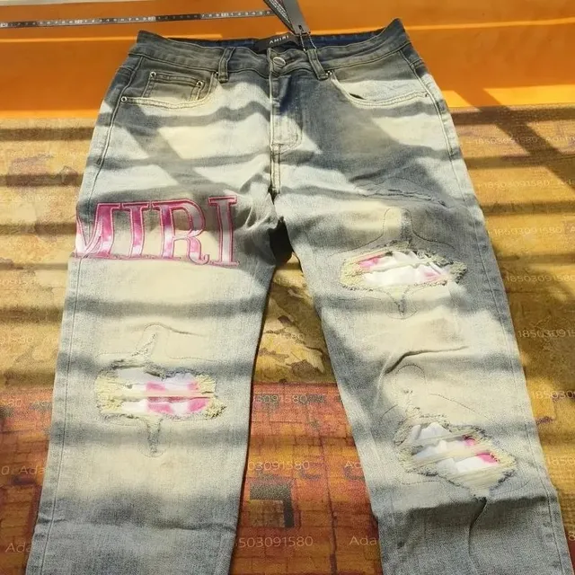 Amiri Distressed Jeans Pink Logo Wash