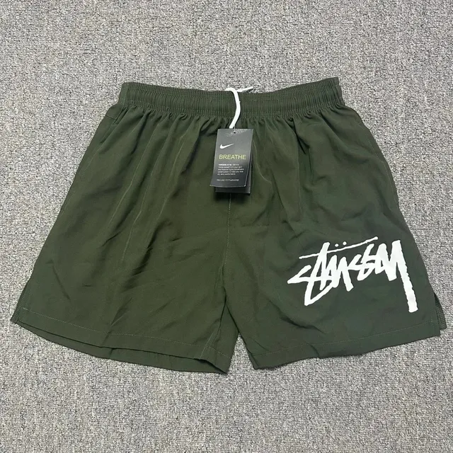 Stüssy × Nike Breathe Shorts Olive with White Logo