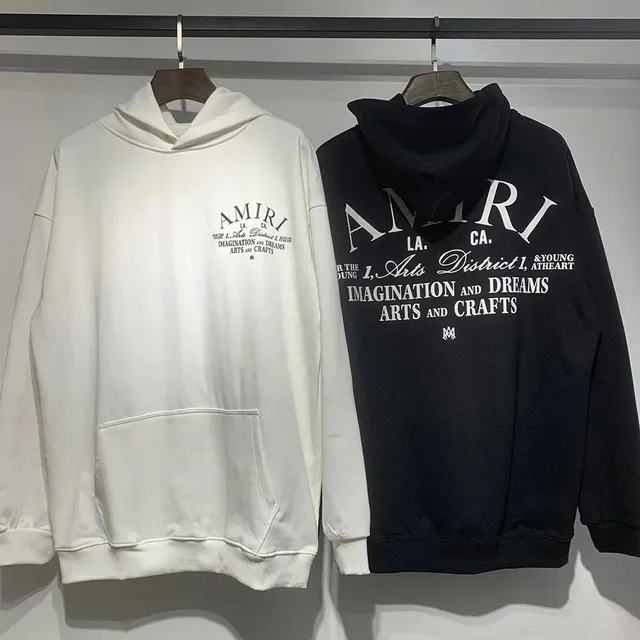 Amiri hoodie arched 'AMIRI' logo with 'L.A. CA.' and 'IMAGINATION AND DREAMS' text