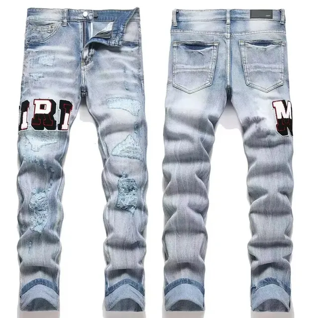 Amiri Distressed Logo Jeans Patchwork Logo