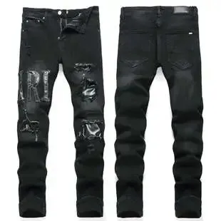 Amiri Distressed Jeans Ripped with Metallic Patch