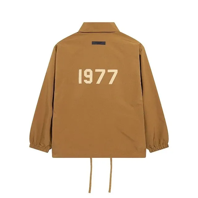 Fear of God Essentials Coach Jacket 1977 Print