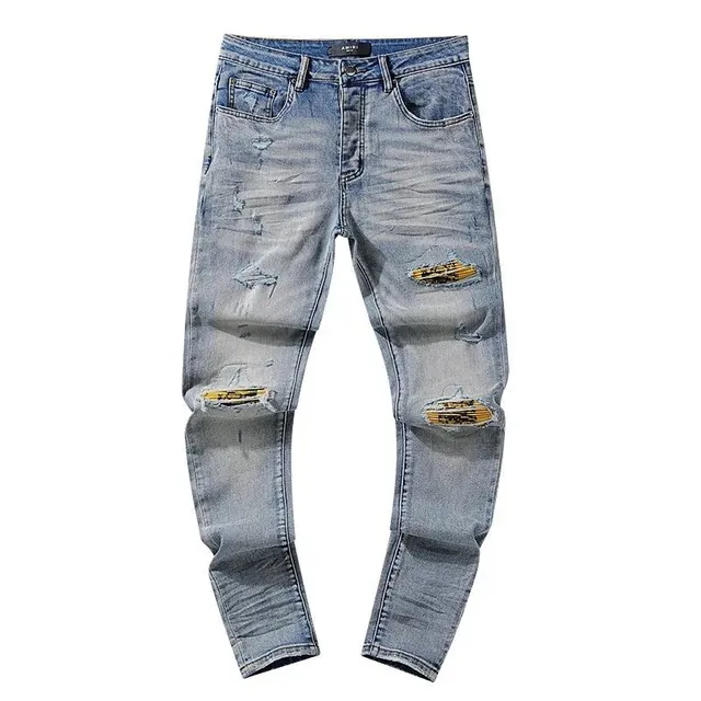 Amiri Distressed Jeans Ripped with Gold Patch
