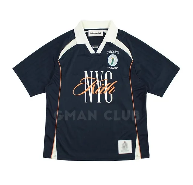 Kith shirt navy with white collar, orange script 'Kith' and 'NYC' print
