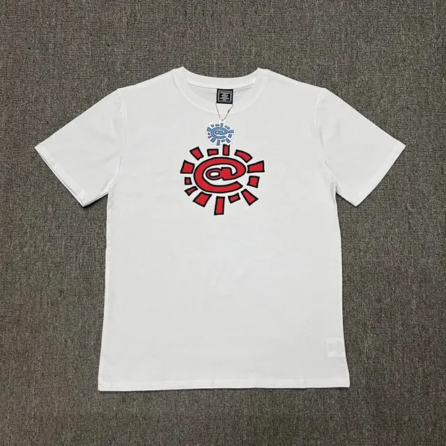 KAWS Graphic Tee Sunburst Logo