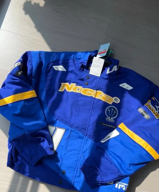 NOCTA Racing Jacket Blue Yellow Logo