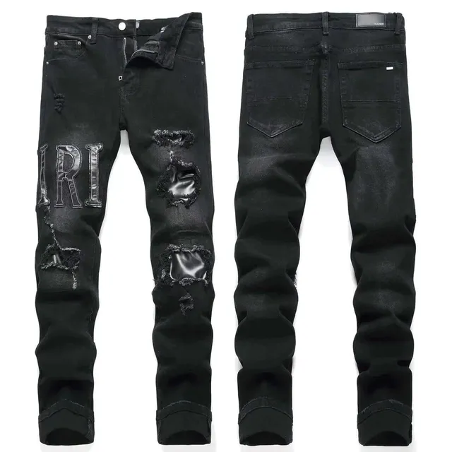 Amiri Distressed Jeans IRI Logo Patch