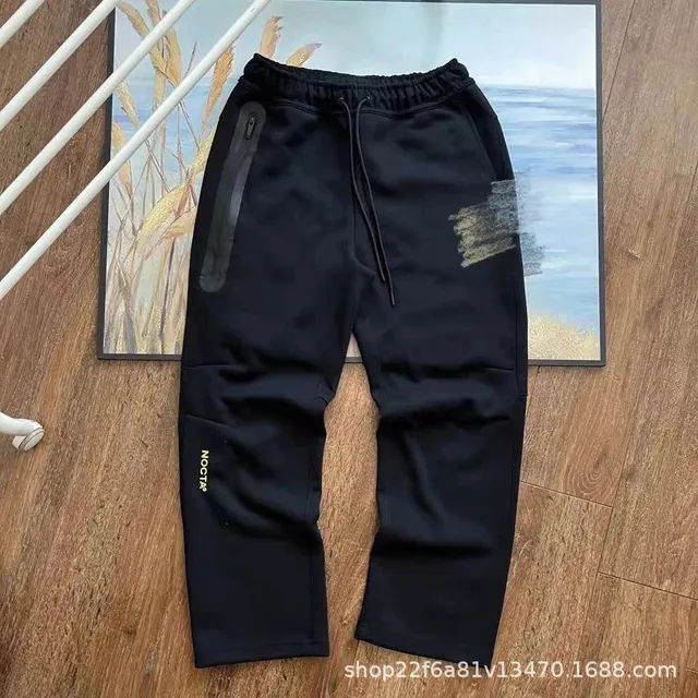 NOCTA Tech Fleece Joggers Black with Gold Logo