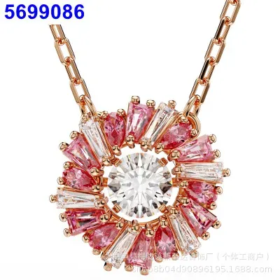 Pink rotating sun necklace