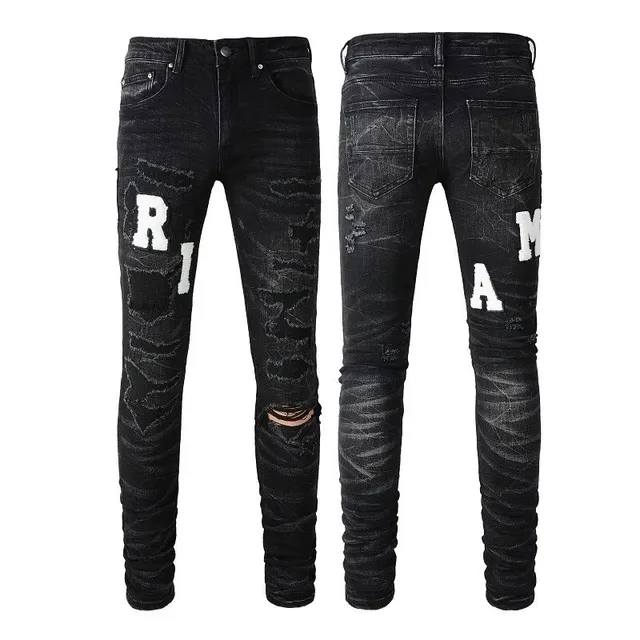 Amiri Distressed Logo Jeans Ripped with White Lettering