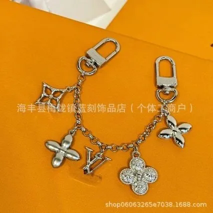 Louis Vuitton LV Flower Charm Keychain Metallic with Crystal Accents