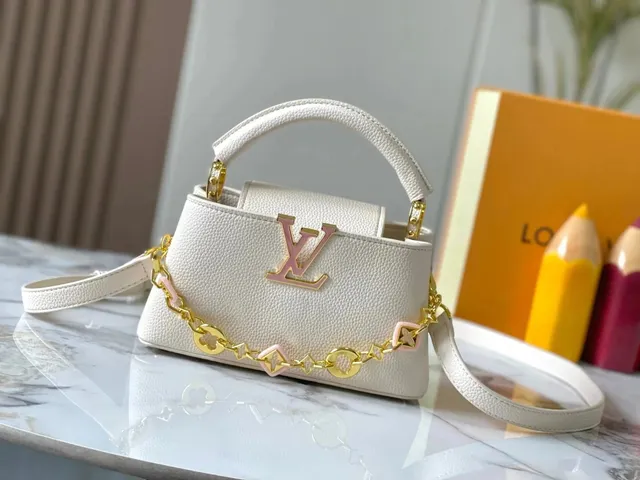 Louis Vuitton On The Go White Taurillon Leather with Pink LV Twist
