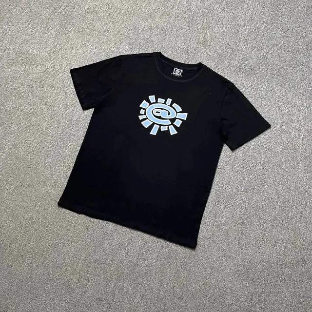 Corteiz Sun Logo Tee Light Blue Graphic