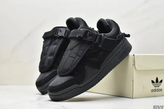 Adidas sneakers all-black with strap closure and three-stripe detail