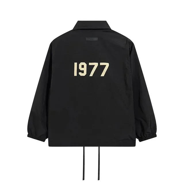 Fear of God Essentials Coach Jacket 1977 Print