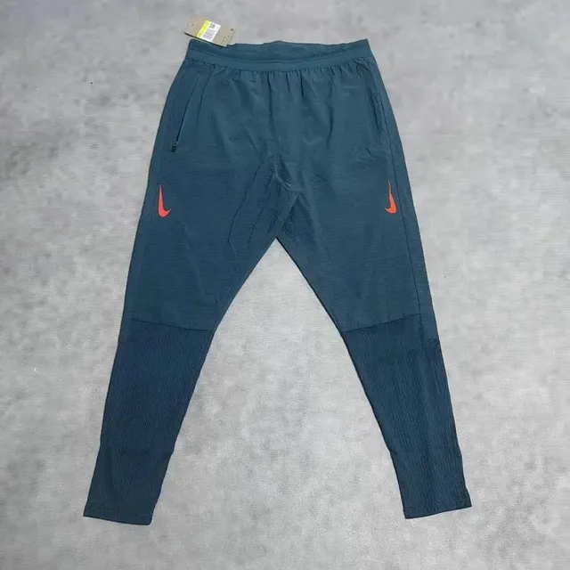 Nike Tech Fleece Joggers Navy with Orange Swoosh