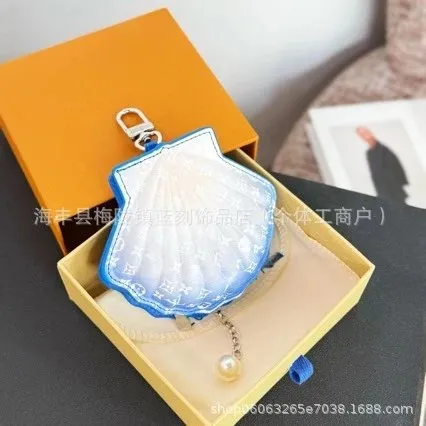 Louis Vuitton Shell Charm Monogram Canvas