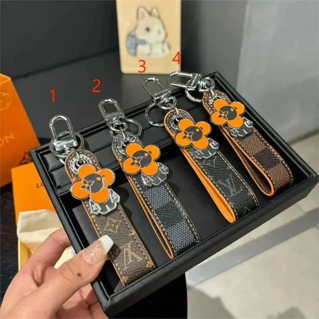 Louis Vuitton Key Holder Monogram Canvas with Orange Flower Charm