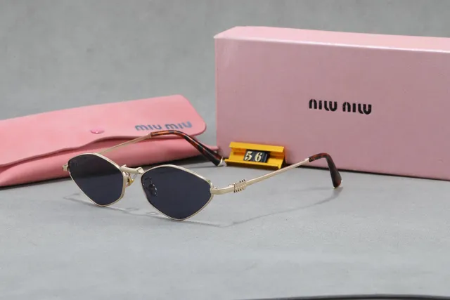 Miu Miu Oversized Cat-Eye Sunglasses Gold Frame with Tortoiseshell Temples