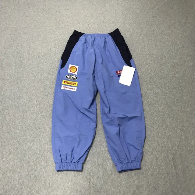 Supreme Track Pants Shell Pirelli Brembo Arai Patch