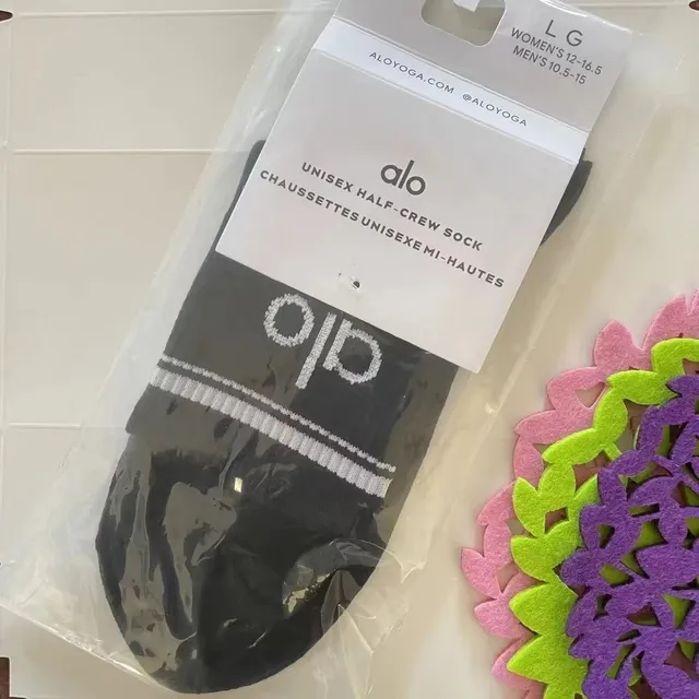 Alo Yoga Unisex Half-Crew Sock Black with White Logo and Stripe