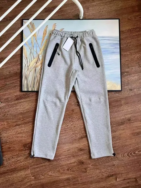 Nike Tech Fleece Joggers Heather Grey with Black Zip Pockets