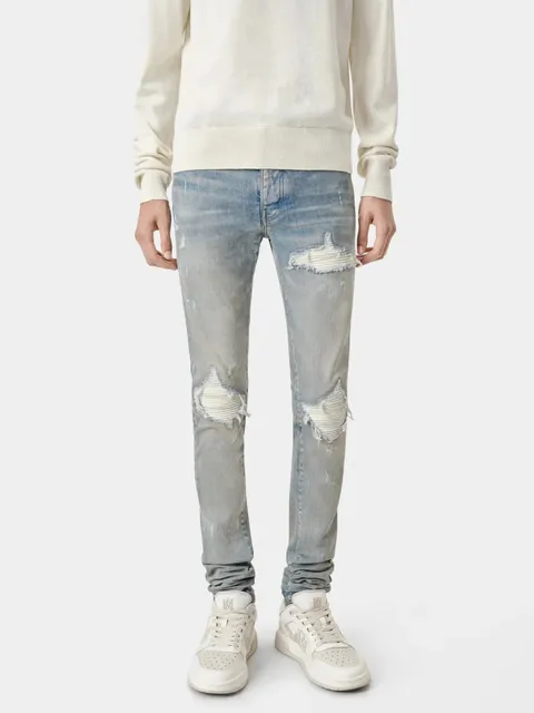 Amiri Distressed Slim Fit Jeans Light Wash with Ribbed Knee Patches