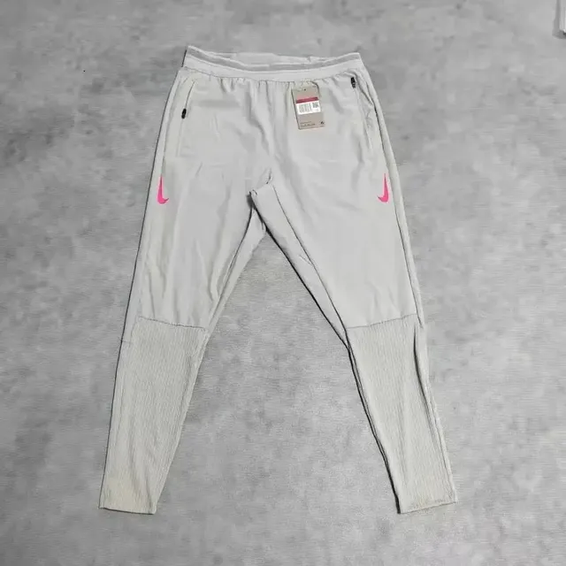 Nike Tech Fleece Joggers Light Grey with Pink Swoosh