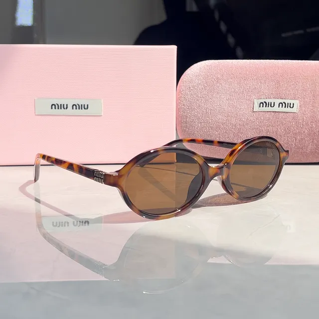 Miu Miu Oval Sunglasses Tortoiseshell