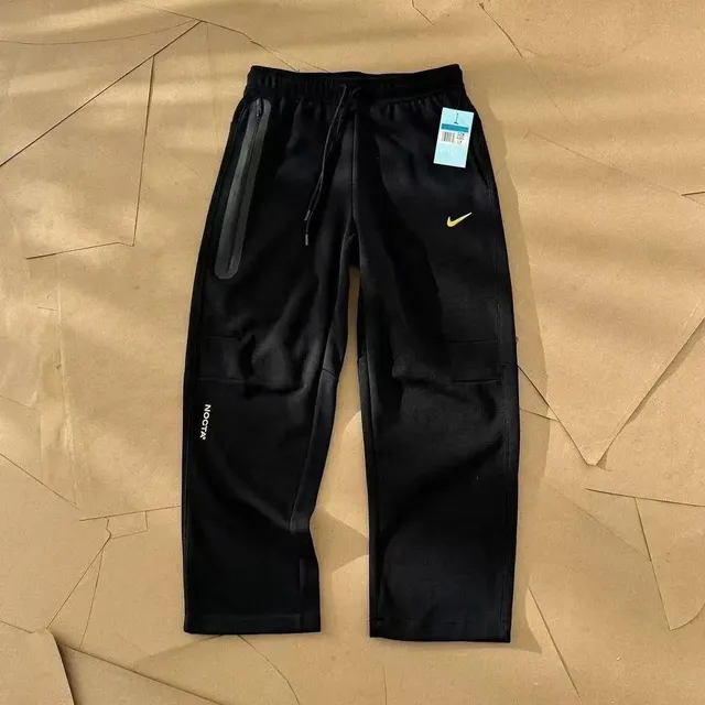 Nike × NOCTA Tech Fleece Joggers Black with Gold Swoosh