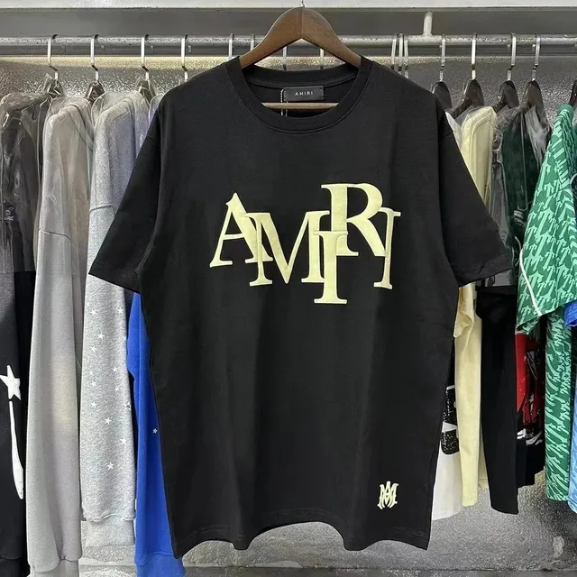 Amiri Logo Tee Gold Logo