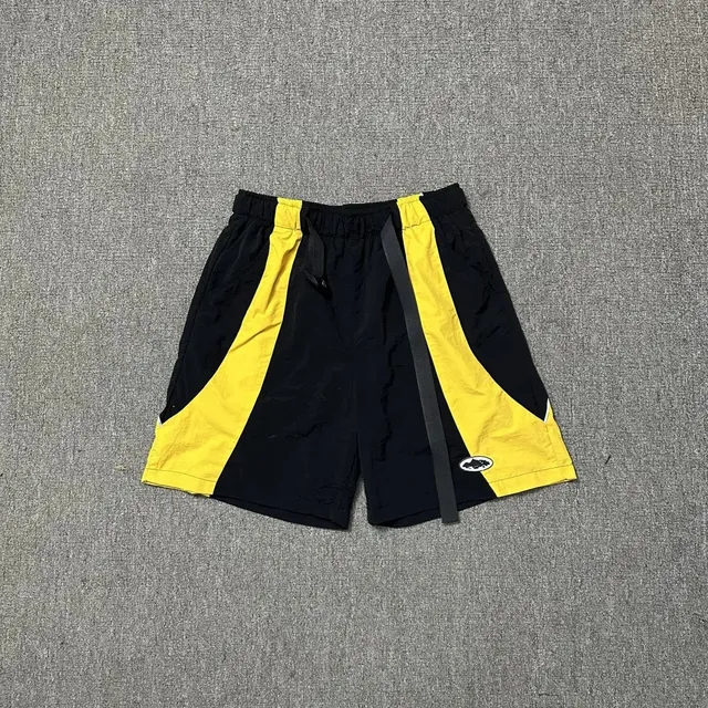 Corteiz Track Shorts Black Yellow Panel