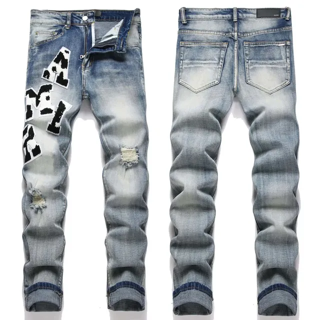 Amiri Distressed Denim Jeans Cow Print Patch