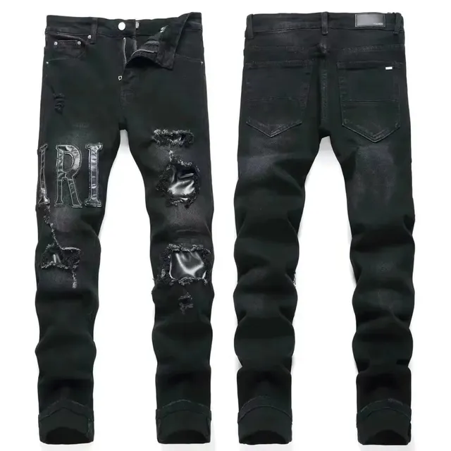 Amiri Distressed Slim Jeans IRI Logo Patch